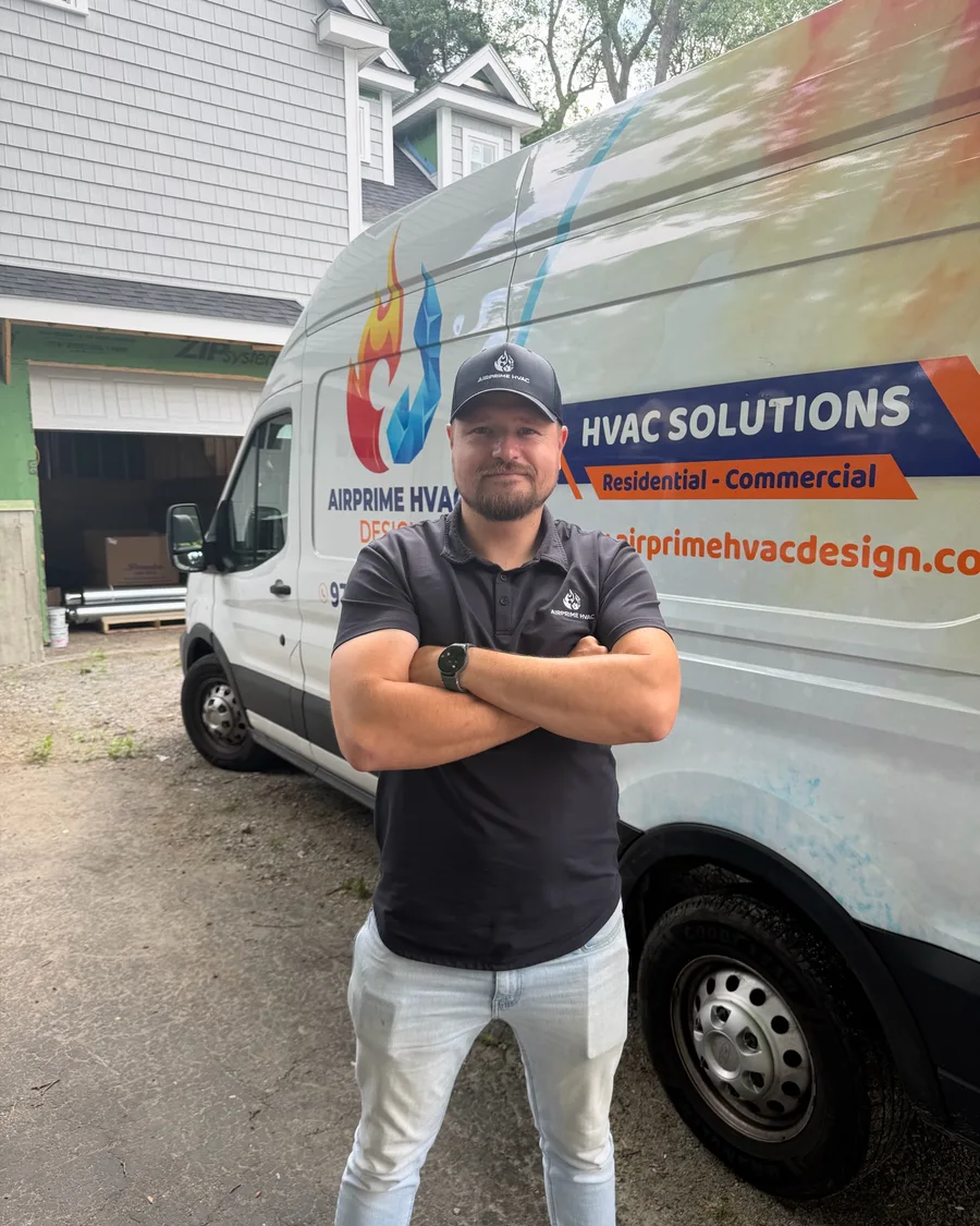 Cristiano Jatva, Chief Estimator at AirPrime HVAC Design, in front of a branded service van